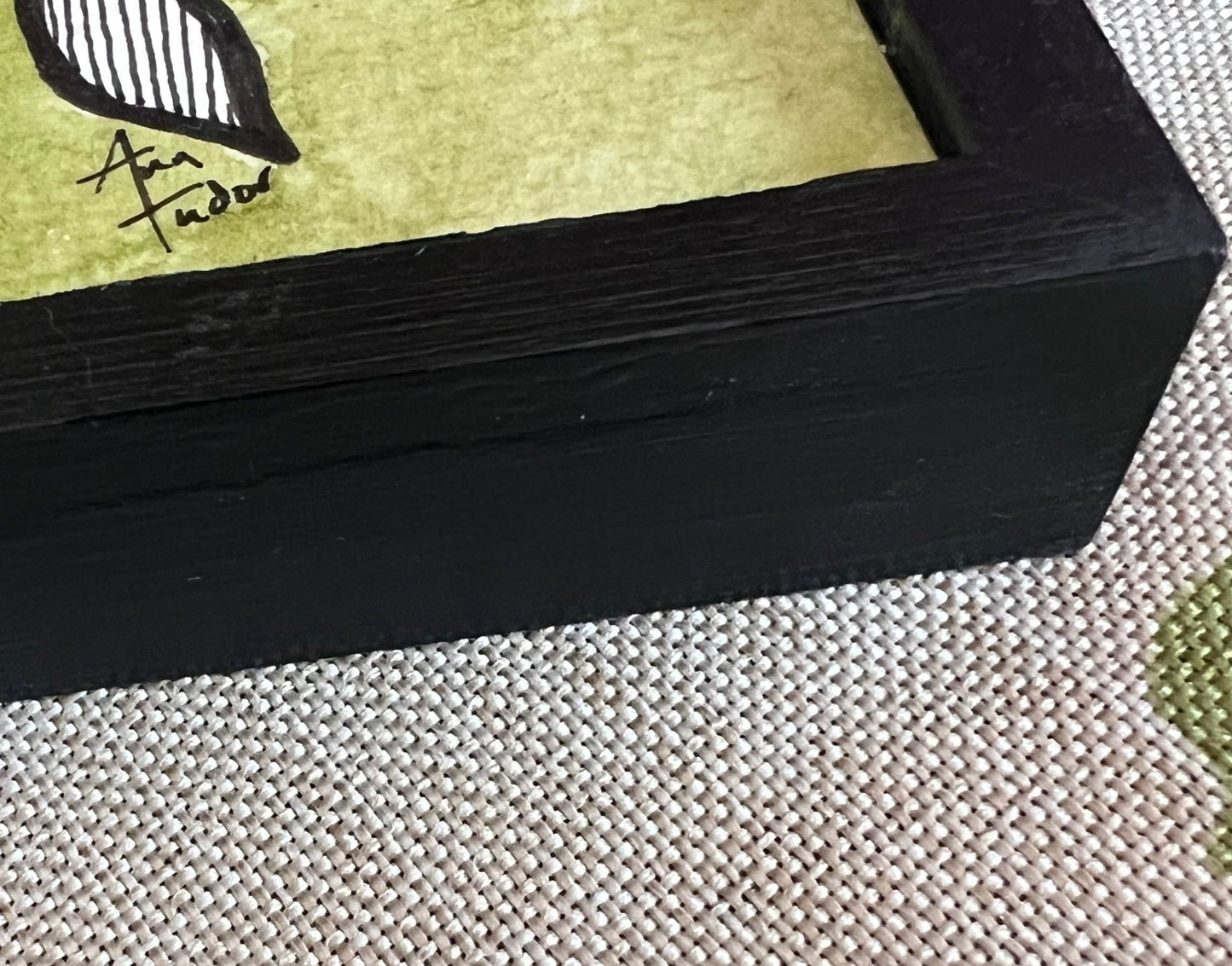 Side view showing frame and Ann Tudor signature