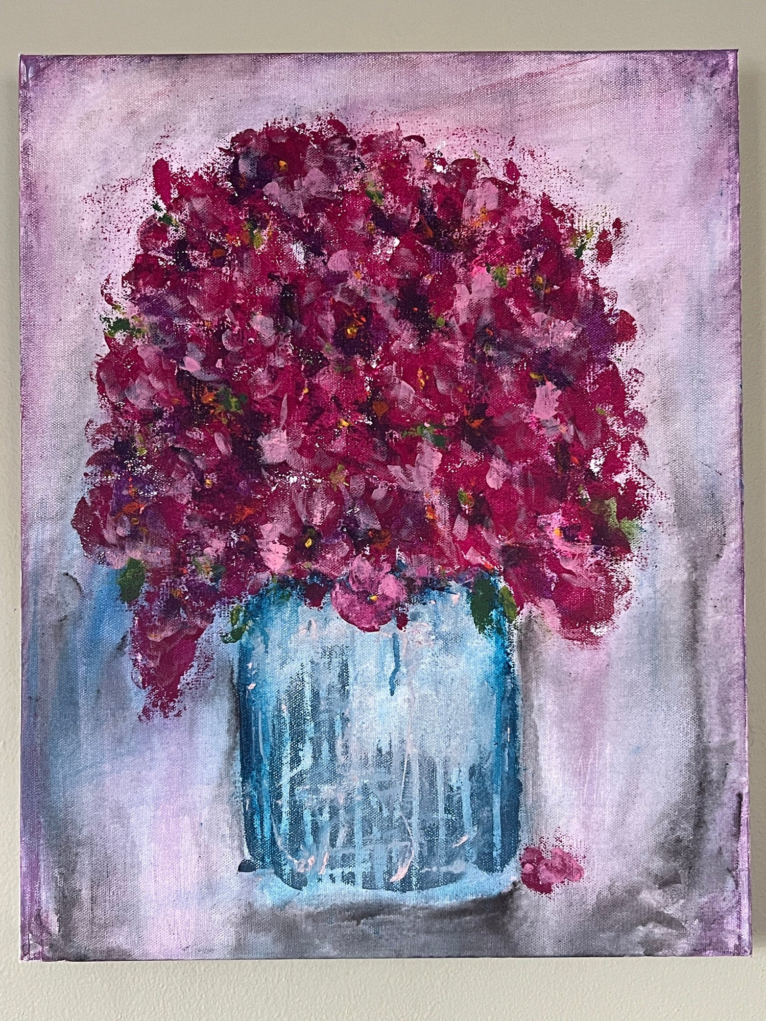 Painting of a blue container filled with deep pink red blooms