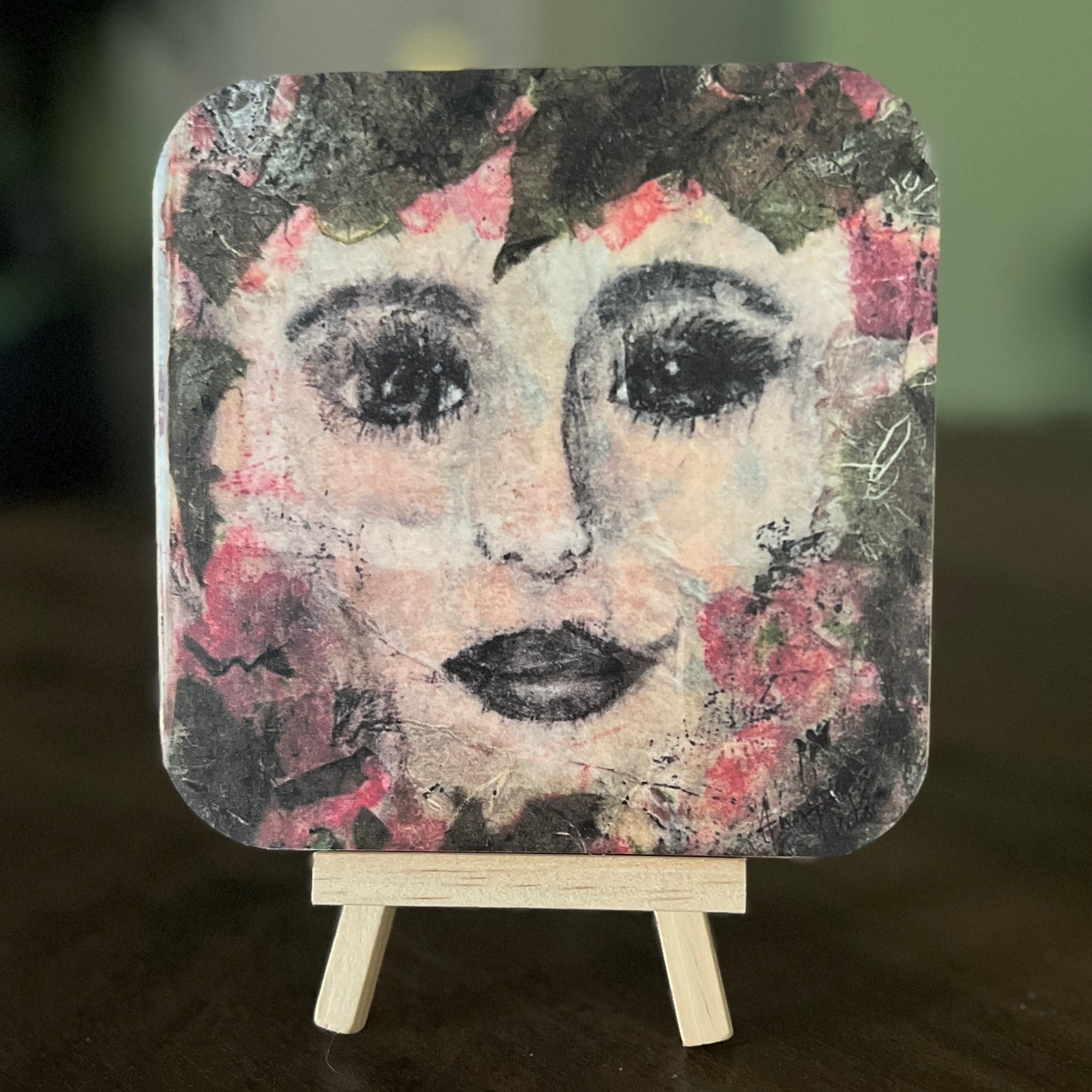 Celeste is a 5x5 mixed-media art board from the Women + Words series — a collectible piece with a hidden message and mini easel