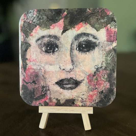 Celeste is a 5x5 mixed-media art board from the Women + Words series — a collectible piece with a hidden message and mini easel