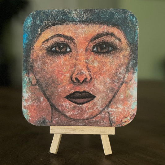Lotti is a 5x5 mixed-media art board from the Women + Words series — a collectible piece with a hidden message and mini easel.